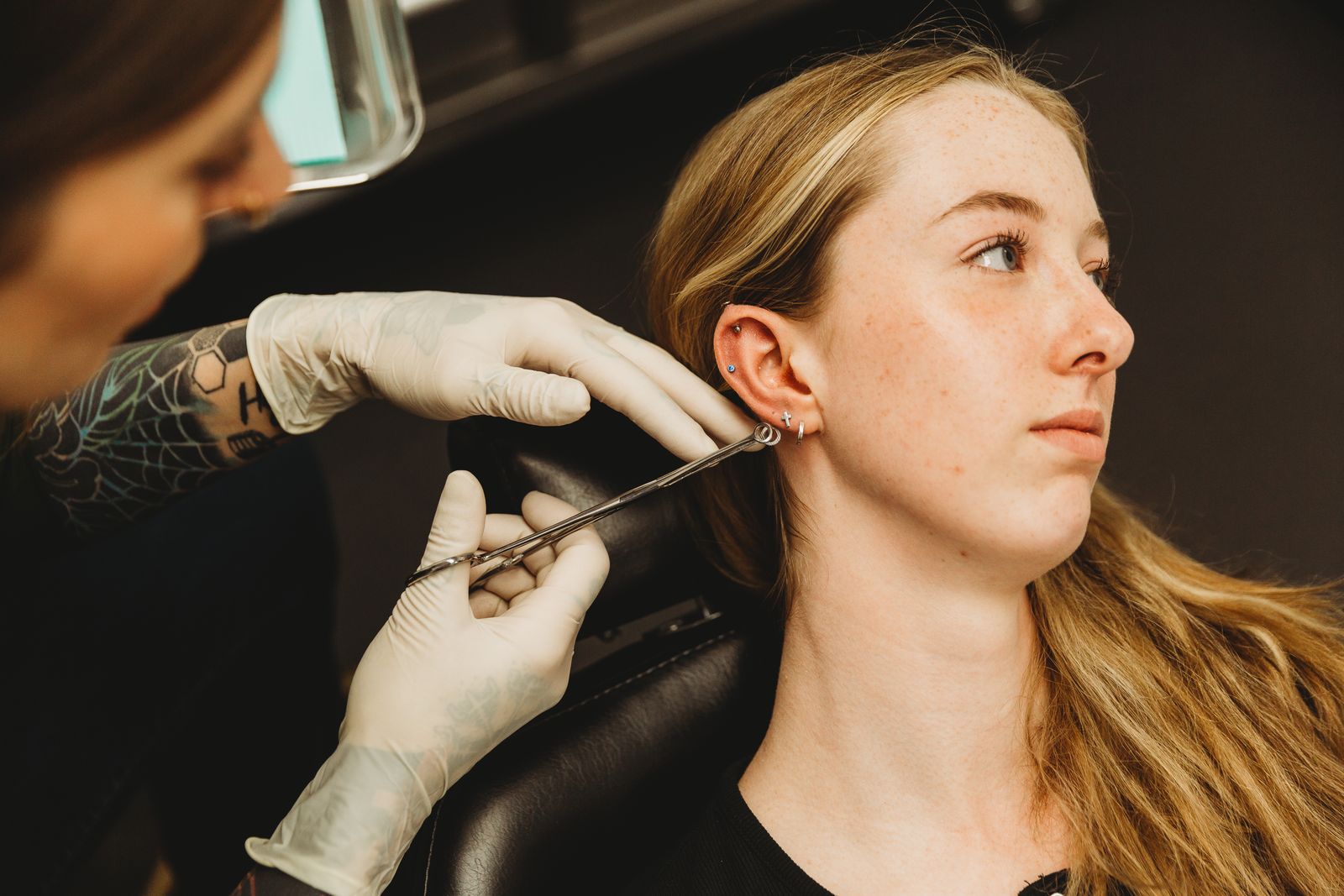 Helix piercing in progress at Peachey Piercing in Dawson Creek